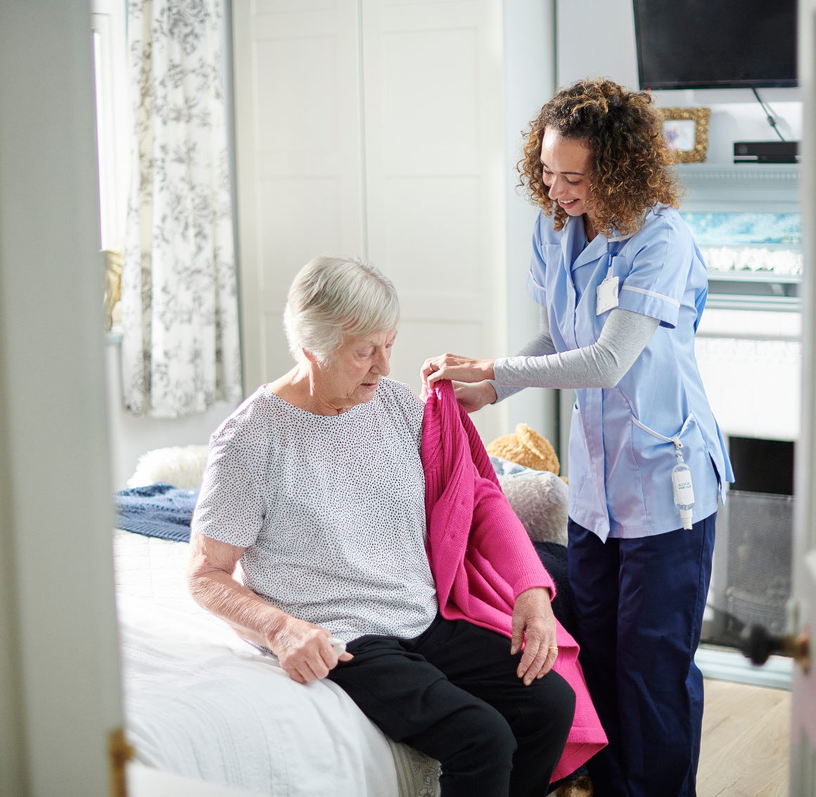 caregiver assisting elderly