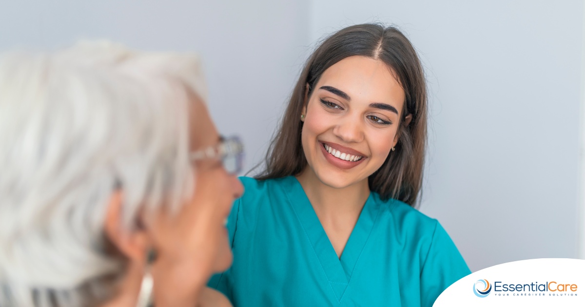 A caregiver smiles with an older client showing the results of successfully starting a new caregiving job.