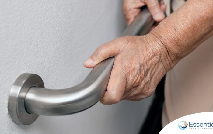 An older adult uses a grab bar representing one of the home modifications that is helpful for fall prevention for elderly adults.