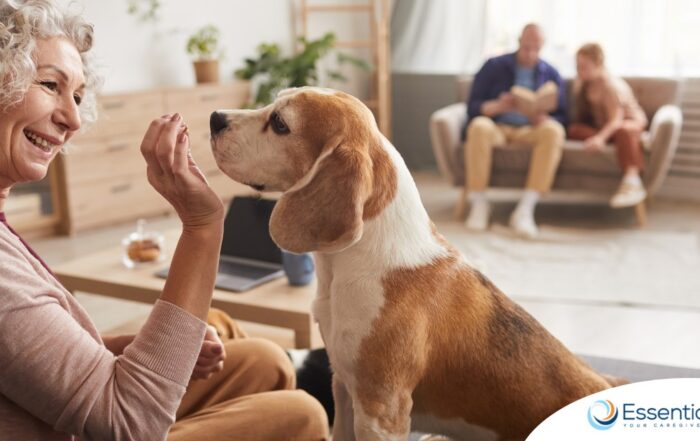 An older woman smiles while giving a dog a treat, representing the joy that dogs can bring.