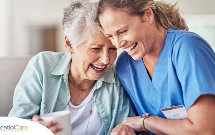 A woman in scrubs laughs with a senior woman, representing how caregiving can be a great career choice.