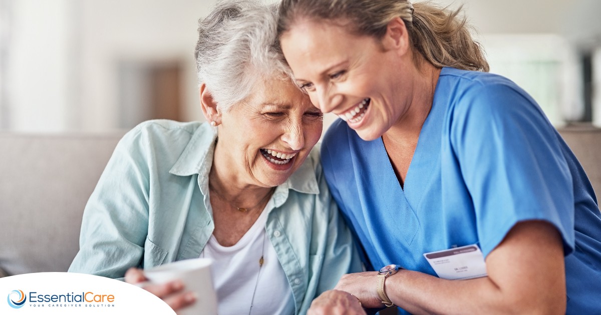 A woman in scrubs laughs with a senior woman, representing how caregiving can be a great career choice.