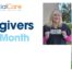 Two Essential Care caregivers proudly holding recognition awards for being selected as Caregivers of the Month.
