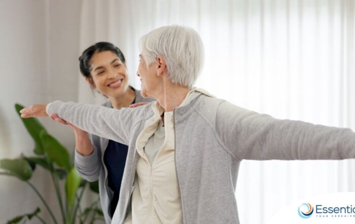 A caregiver and senior practice tai chi as one of many enriching activities for seniors at home.